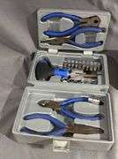 Two Toolkits Featuring Pliers, Sockets, and Bits in Metal and Plastic Cases