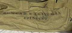 Green Canvas Military Duffle Bag with Straps Marked ‘Edmund E Leistman Approx. 35″ x 20″