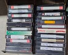 Two Media Storage Units With VHS Tapes