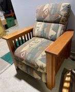 Upholstered Recliner & Barbers Booster Seat for a Child
