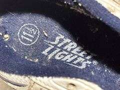 Three Pairs of Children’s Athletic Shoes from Everlast, Nike, and Street Lights