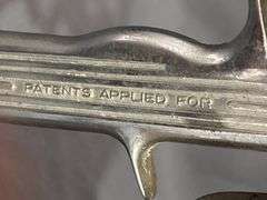 Metal Spray Gun with Attached Canister, Marked ’99-B’