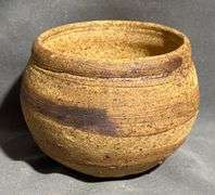 Handcrafted Planter with Textured Surface and Marked Base
