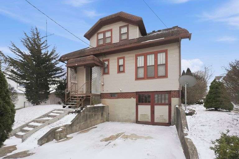 3 Bedroom, 1.5 Bath Home with Full Basement, Lots of Character, Garage & Carport!