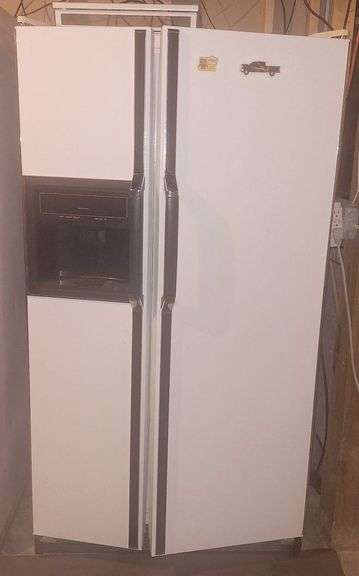 Kenmore Side-by-Side Refrigerator Freezer - Located in basement