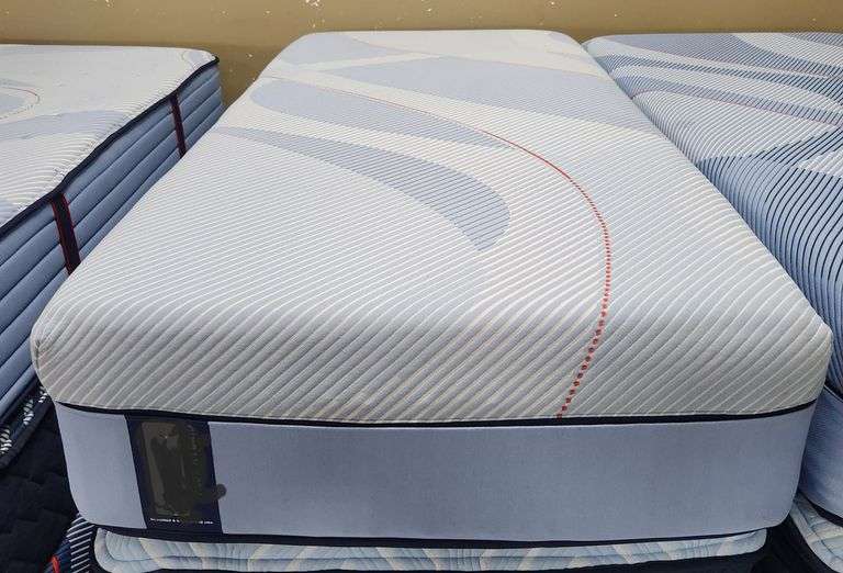 Name brand twin XL size 13" medium firm mattress floor model display or warehouse scuffed