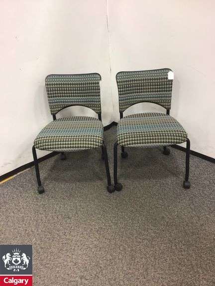 Set of 2 Teknion Amicus low back 4 post chairs no arms with wheels