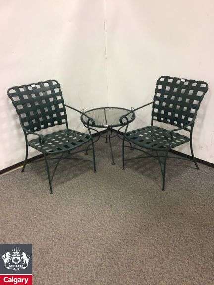 2 green outdoor chairs metal and side table 24.5”w x 19”h