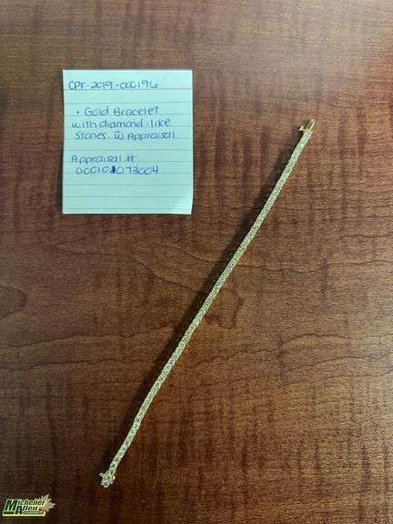 Gold bracelet w/diamond-like stones