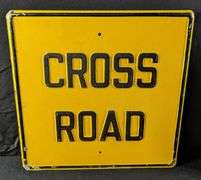EMBOSSED STEEL SIGN CROSS ROAD