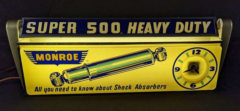 MOTION LIGHTED CLOCK SIGN MONROE SHOCK ABSORBERS