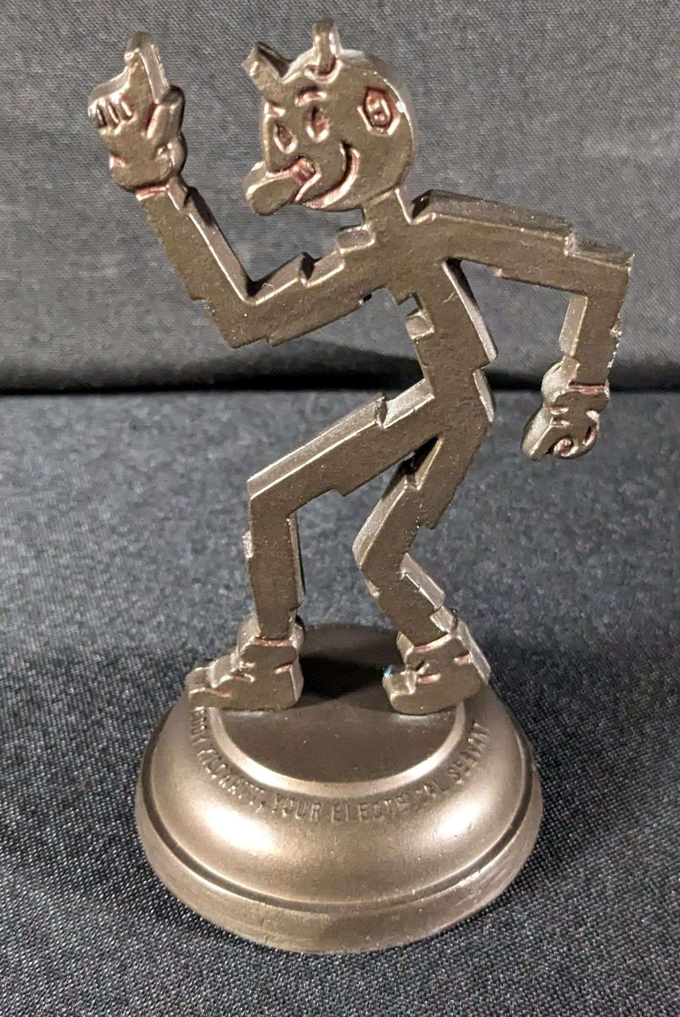 REDDY KILOWATT FIGURAL METAL PAPER WEIGHT - Millers Auction Co.