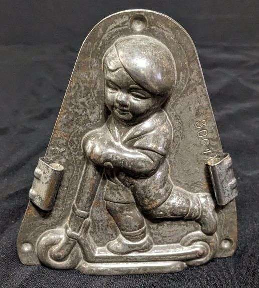 ANTIQUE CHOCOLATE MOLD BOY CHILD ON SCOOTER ANTON REICHE DRESDEN