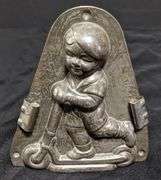 ANTIQUE CHOCOLATE MOLD BOY CHILD ON SCOOTER ANTON REICHE DRESDEN