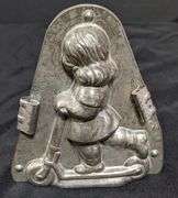 ANTIQUE CHOCOLATE MOLD GIRL CHILD ON SCOOTER ANTON REICHE DRESDEN
