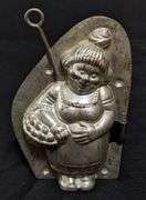 ANTIQUE CHOCOLATE MOLD PORTLY LADY WITH A BASKET OF BISCUITS