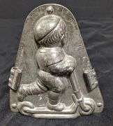 ANTIQUE CHOCOLATE MOLD BOY CHILD ON SCOOTER ANTON REICHE DRESDEN