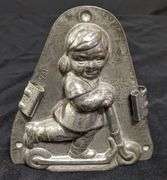 ANTIQUE CHOCOLATE MOLD GIRL CHILD ON SCOOTER ANTON REICHE DRESDEN