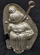 ANTIQUE CHOCOLATE MOLD PORTLY LADY WITH A BASKET OF BISCUITS