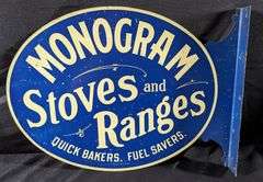 TIN FLANGE SIGN MONOGRAM STOVES & RANGES (QUINCY ILLINOIS)