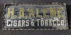 SCALLOPED EDGE GLASS SIGN H. A. KLEIN CIGARS & TOBACCO