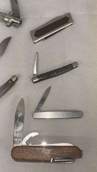 Collection of Assorted Pocket Knives with Multi-Blade Designs