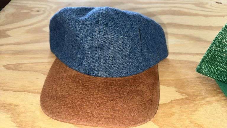 Variety of  New or Lightly Used Trucker Hats with NRA, Caterpillar, and WordPerfect Designs