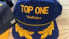 Variety of  New or Lightly Used Trucker Hats with NRA, Caterpillar, and WordPerfect Designs