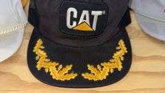 Variety of  New or Lightly Used Trucker Hats with NRA, Caterpillar, and WordPerfect Designs