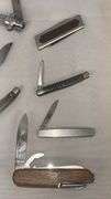 Collection of Assorted Pocket Knives with Multi-Blade Designs