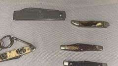 Collection of Pocket Knives with Various Handle Materials and Keychain Feature
