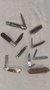 Collection of Assorted Pocket Knives with Multi-Blade Designs