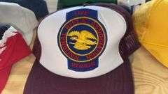 Variety of  New or Lightly Used Trucker Hats with NRA, Caterpillar, and WordPerfect Designs