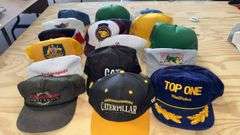 Variety of  New or Lightly Used Trucker Hats with NRA, Caterpillar, and WordPerfect Designs