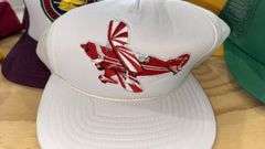 Variety of  New or Lightly Used Trucker Hats with NRA, Caterpillar, and WordPerfect Designs
