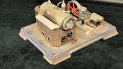 Vintage Model Steam Engine with Red Flywheel and Boiler