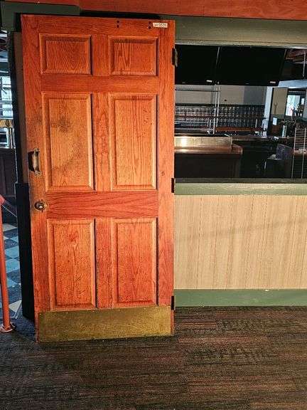 Reddish-Brown Wood Restroom Door, Brass Kick Plate