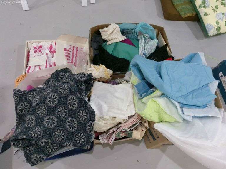 Multiple boxes of various material. Located in basement.