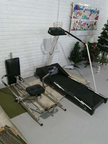 Vitamaster treadmill. Vitamaster rower exercise machine. Located in basement.