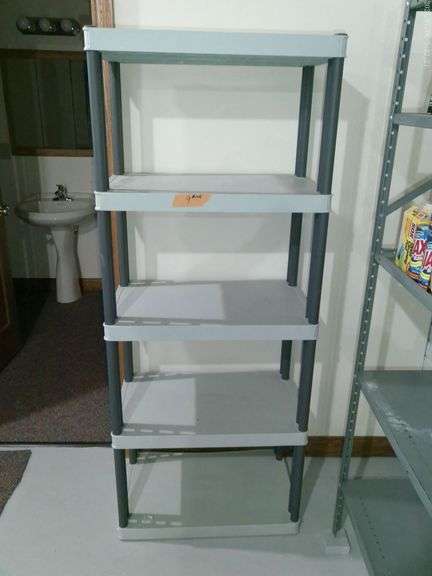 5 shelf plastic shelving unit. 27.5 inches wide x 17 inches deep x 5 foot 8.5 inches tall. Located i