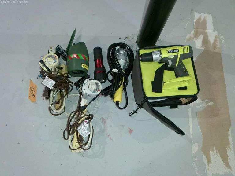 Ryobi drill, no battery no charger. Trouble light and extension cords. Located in basement.