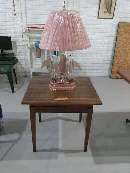 Swivel top wooden end table. 2 ft. X 2.3 ft. X 2.1 tall. Table lamp. Located in basement.