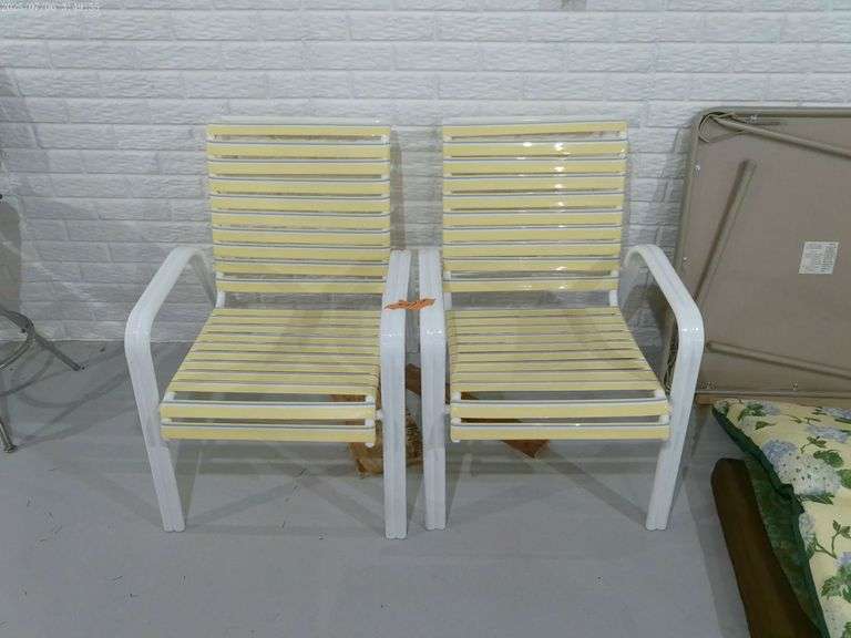 2 patio chairs. Metal frames. Located in basement.