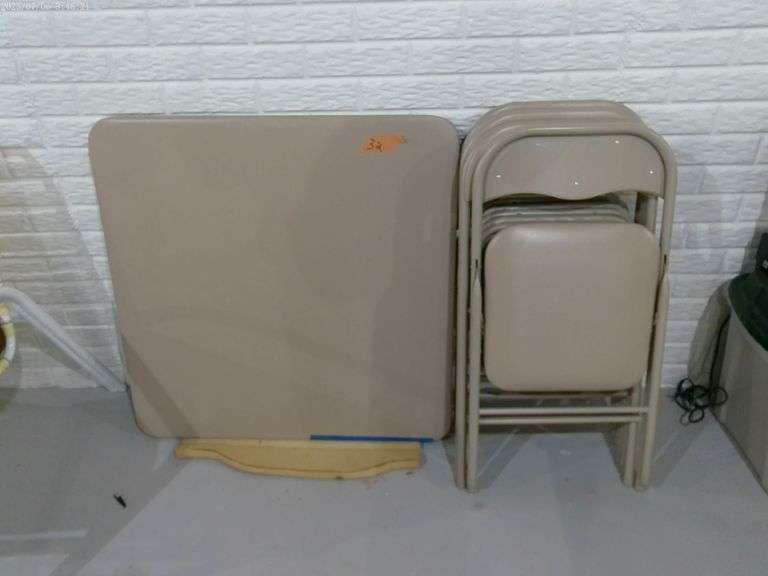Card table & 4 padded chairs. Good condition. Located in basement.