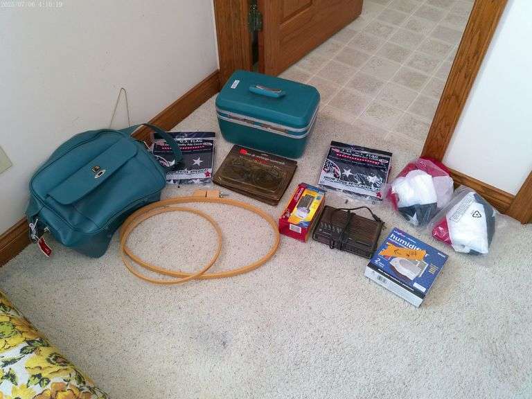 American flags, small filters, makeup case, shoulder bag, and miscellaneous. Located in master bedro