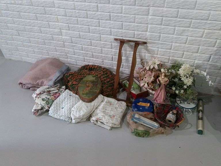 Blankets, light bulbs, artificial flowers in pots, miscellaneous. Located in basement.
