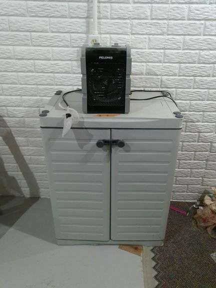 Polonis heater and plastic storage container with contents. Heater works great. Storage is 27.5 inch