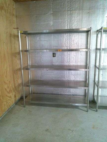 Stainless steel 4 tiered shelf unit 71 inches tall 50 inches wide