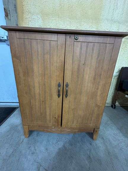 Wooden storage cabinet with door storage. 30" wide, 16" deep, 36" tall