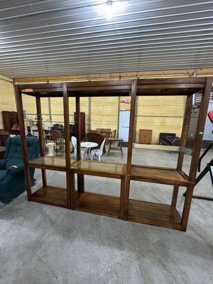 3 piece entertainment center with glass shelves. Overall size is 8'1" wide x 6' 2" tall x 16" deep.